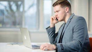 Lewis Raymond Taylor focused on his laptop